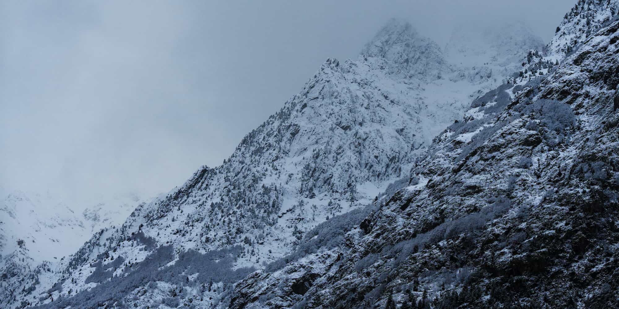 Snowy mountain, dimly lit.